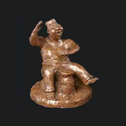 bronze sculpture of ancient drummer created by Carol Ssakai entitled Laughing Spirit